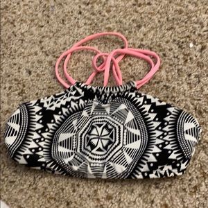 Black, white, and light pink swimsuit top